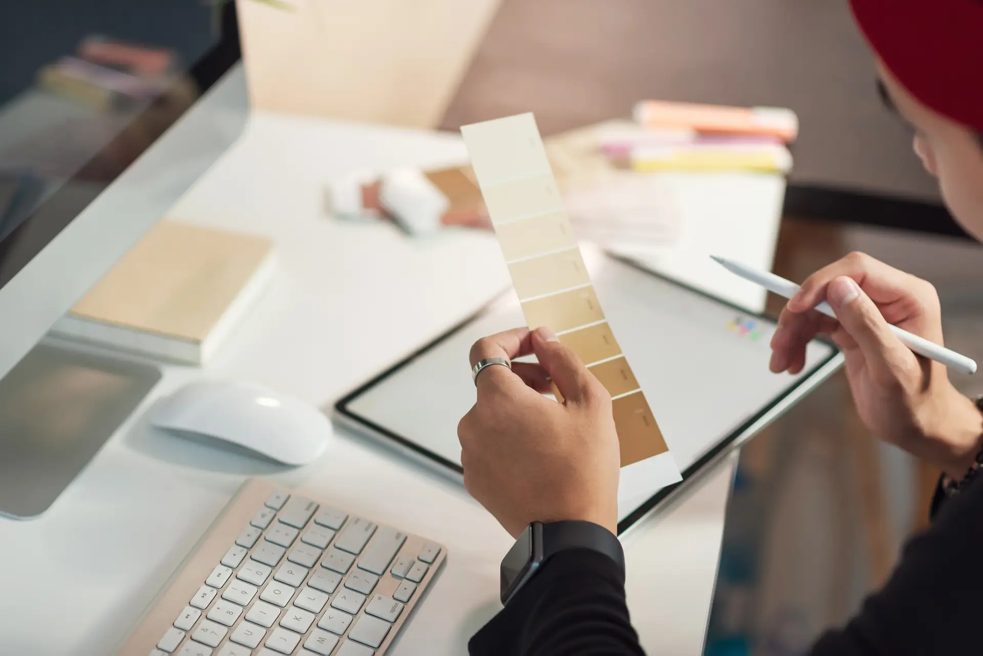 Young man designer choose a palette of brown tones in their office design.